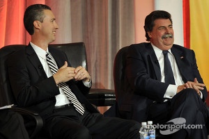 President and CEO of Grand American Road Racing, Ed Bennett and NASCAR President Mike Helton speak onstage at the NASCAR Motorsports Forum