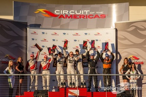 P1 podium: class and overall winners Lucas Luhr and Klaus Graf, second place Tony Burgess and Chris McMurry, third place Andy Meyrick and Katherine Legge
