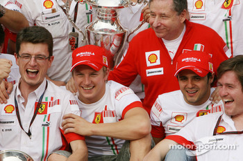 Chris Dyer, at Raikkonen right side, celebrates 2007 World Championship with Felipe Massa, Jean Todt, and Ferrari team members.