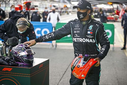 Hamilton presented with Schumacher helmet after record win