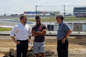 SMI President Marcus Smith, NASCAR driver Bubba Wallace and Charlotte Motor Speedway Executive Vice-President and General Manager Greg Walter