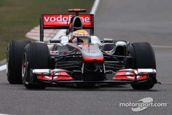 Button drove into the Red Bull pit area