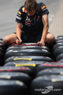 Red Bull Racing mechanic works on Pirelli Tires