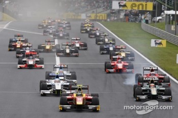 Christian Vietoris leads Jules Bianchi, Giedo Van der Garde and the rest of the field into turn one on the opening lap of the race