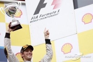 Romain Grosjean celebrates winning the 2011 GP2 Series title on the podium