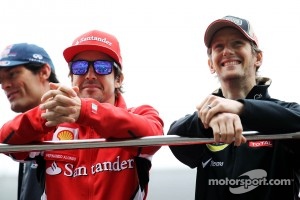 Fernando Alonso, Scuderia Ferrari with Romain Grosjean, Lotus F1 Team on the drivers parade