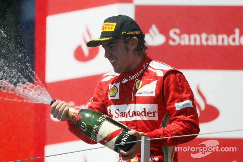 European GP race winner Fernando Alonso, Ferrari celebrates on the podium