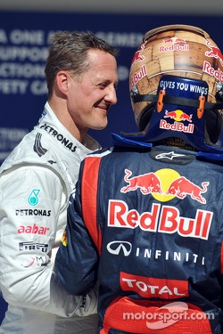 Polesitter Sebastian Vettel, Red Bull Racing celebrates with Michael Schumacher, Mercedes AMG F1