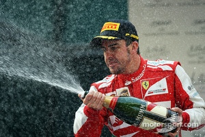 Race winner Fernando Alonso, Ferrari celebrates on the podium
