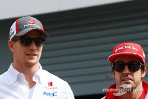 (L to R): Nico Hulkenberg, Sauber and Fernando Alonso, Ferrari on the drivers parade